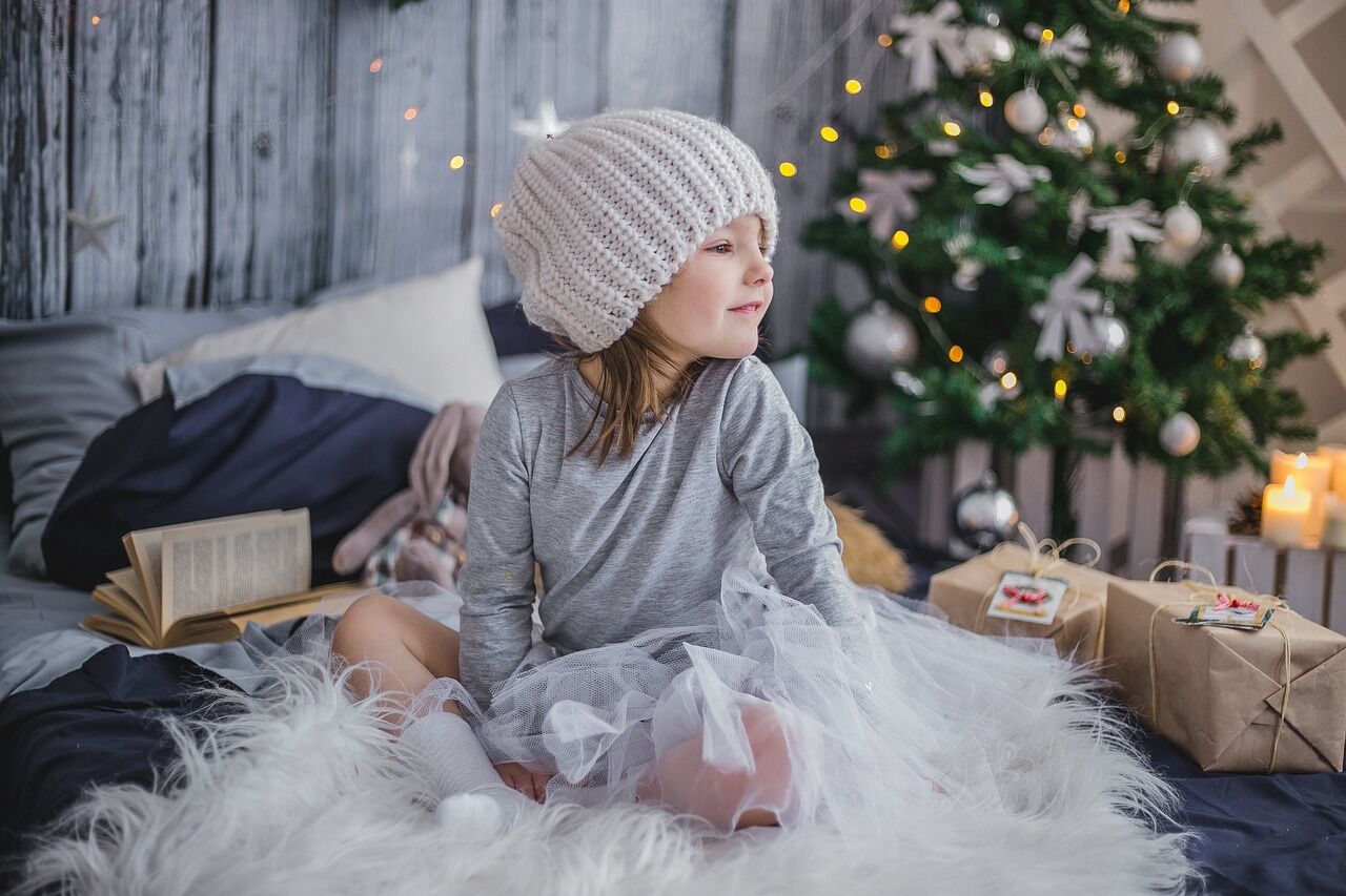 Little girl is kept busy to ensure the holiday season is even more magical